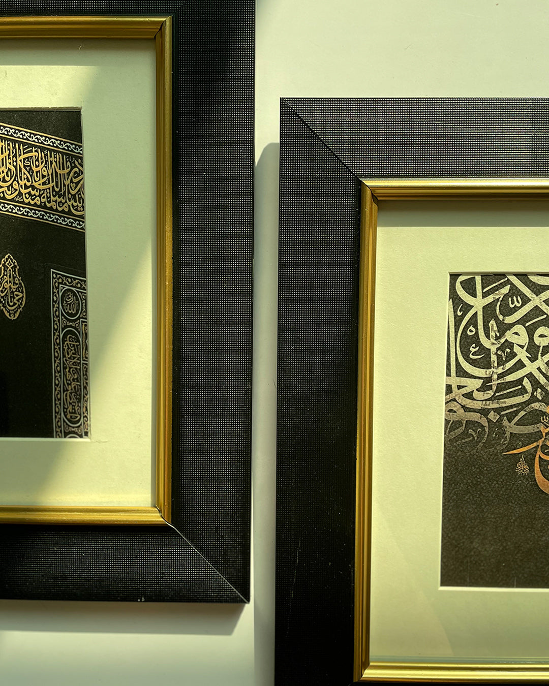 Close-up of black PVC wood Islamic frame with gold artwork, for home and office.