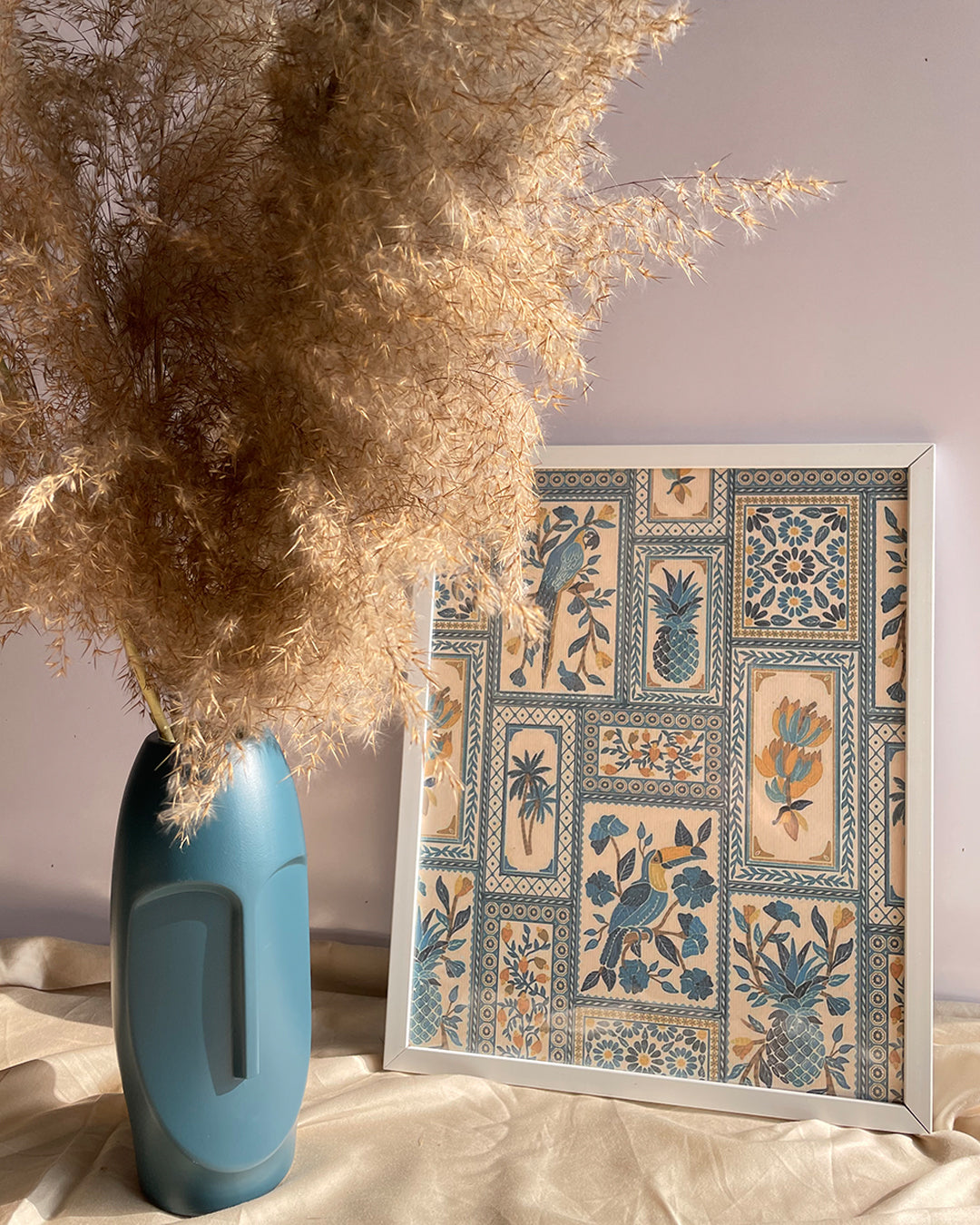 Jay frame held above beige cushion showing frame depth and design