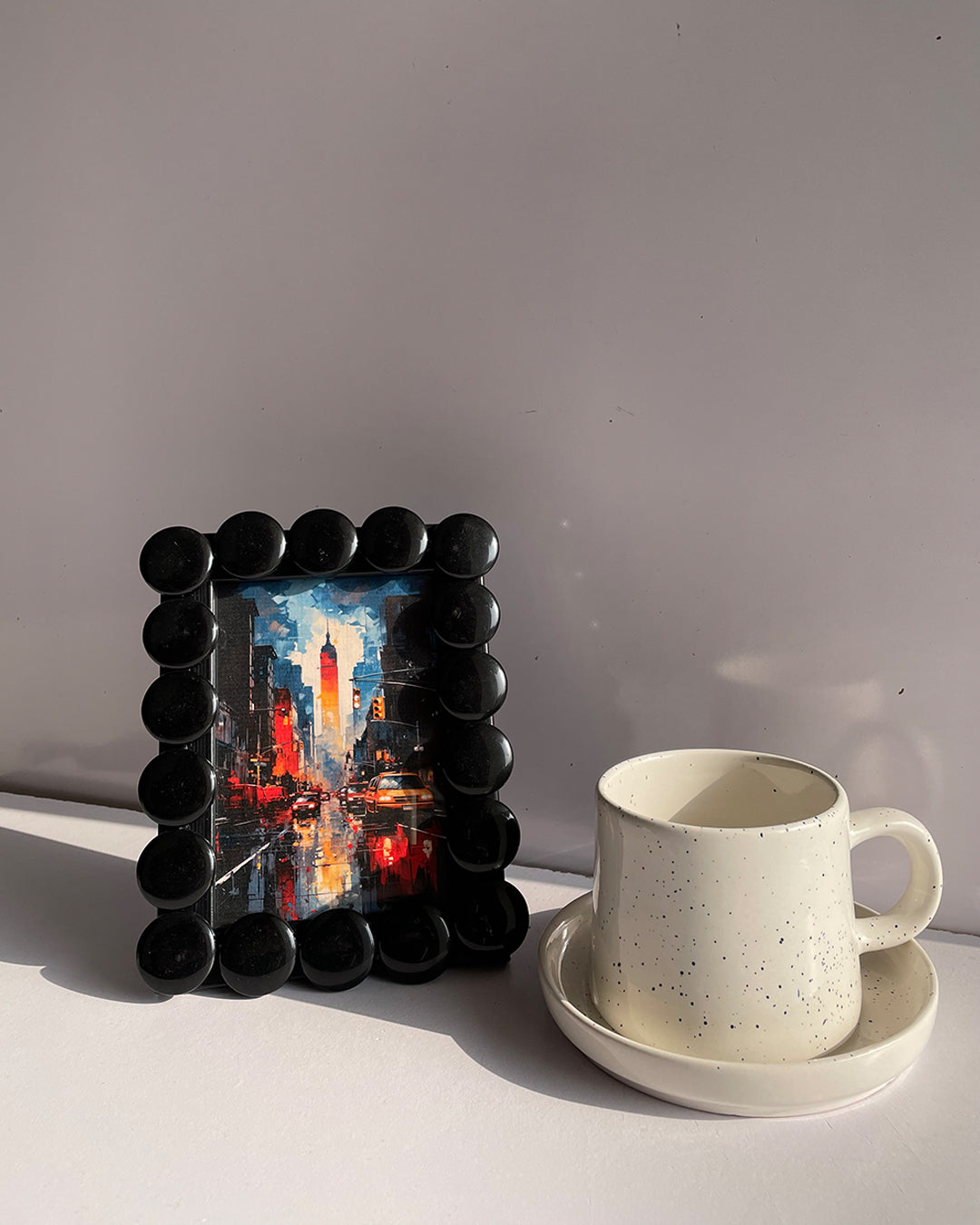 Frame next to a coffee mug