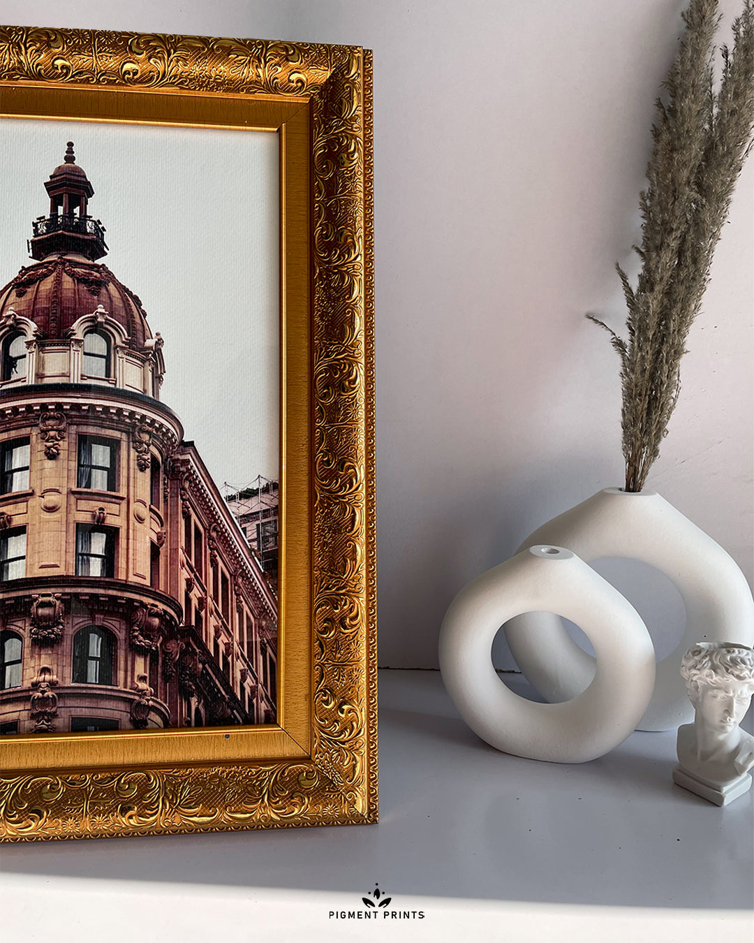 Luxe gold frames styled together for a gallery look