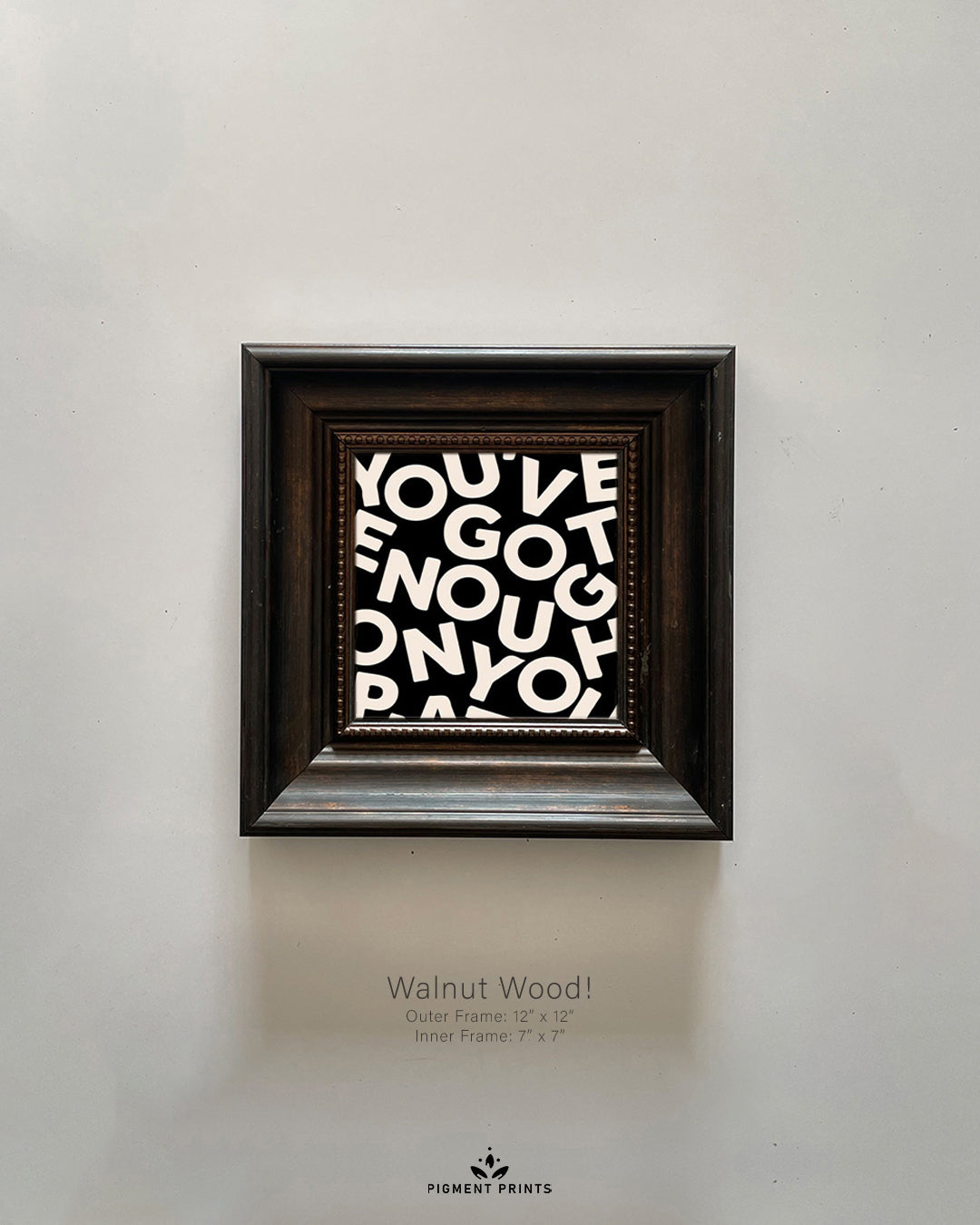 Walnut wood Islamic wall art frame on beige wall