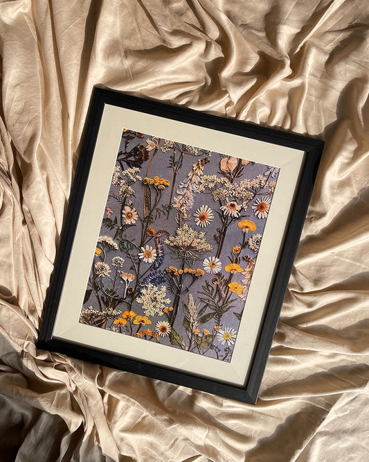 Black floral framed artwork on wall