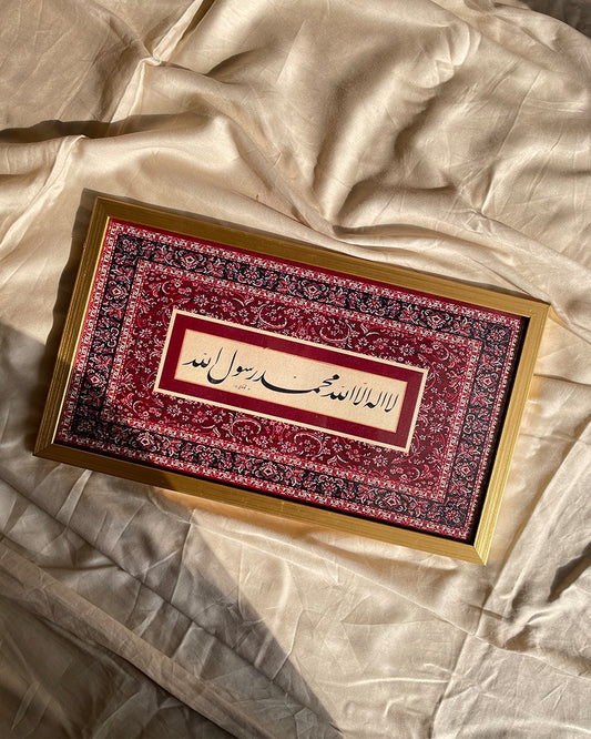 Front view of gold Kalma frame placed on textured background
